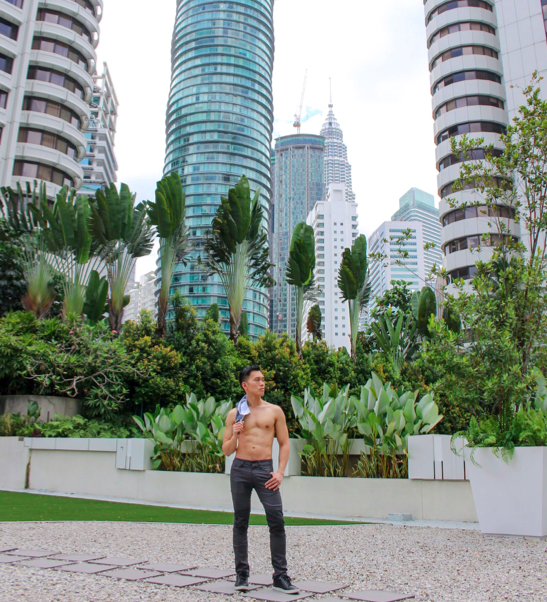ManAboutWorld global corresondent Barry Hoy contemplating the city of Kuala Lumpur shirtless. Because. 